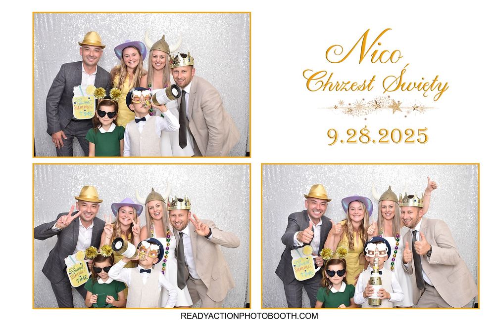 Extended family group photo in a photo booth at a christening